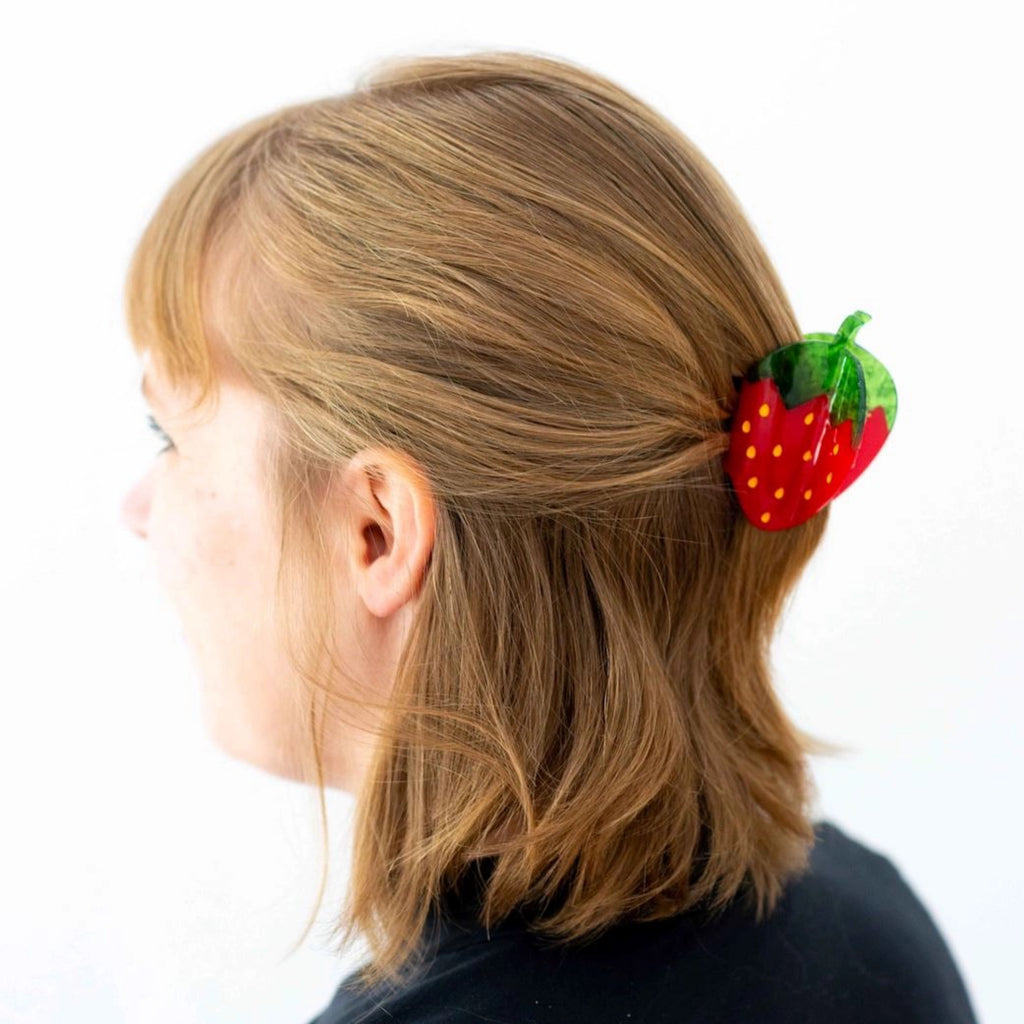 Person wearing Midi Red Strawberry Hair Claw.