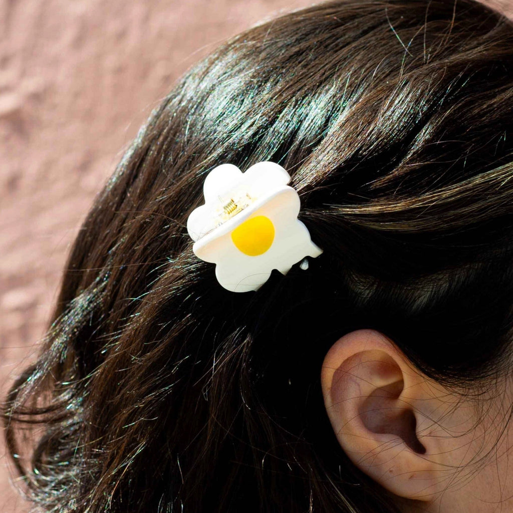 Person wearing Mini Flower Hair Claw.
