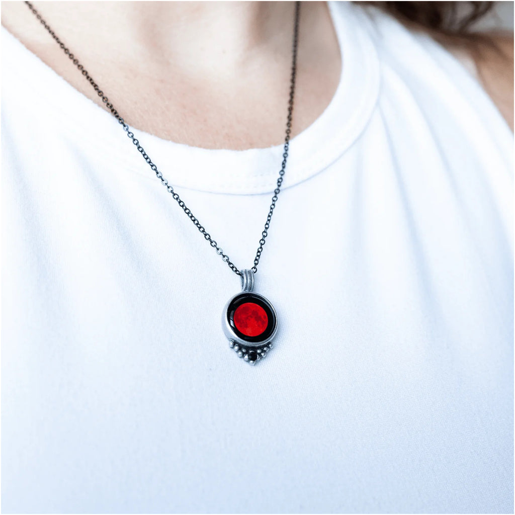 Person wearing Moon Necklace With Black Crystal Lunar Eclipse.