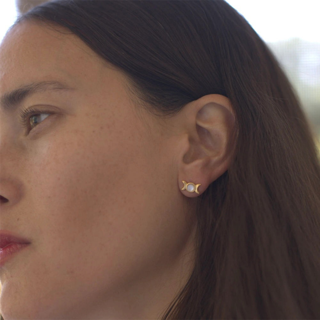 Person wearing Moon Phases Stud Earrings.