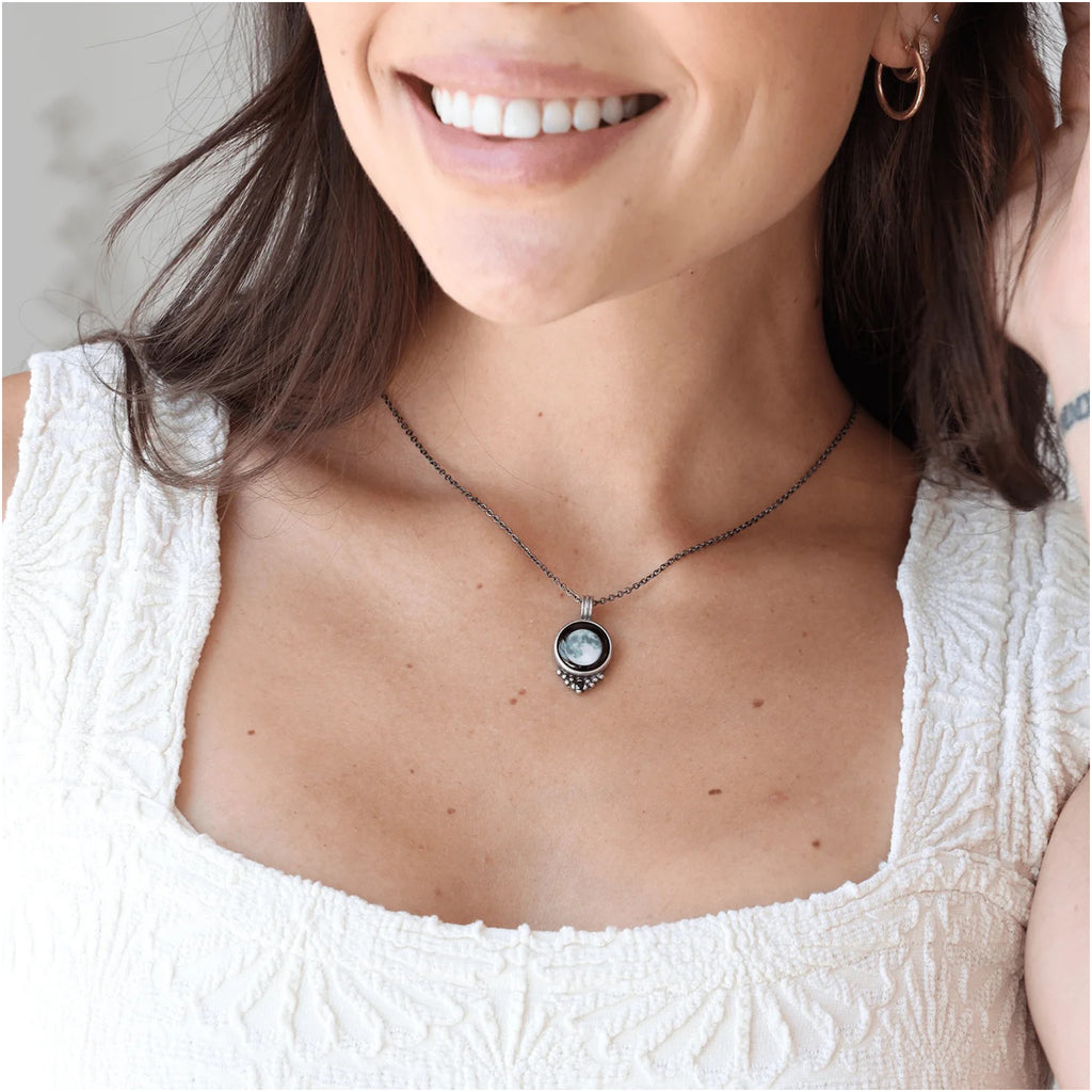 Person wearing Necklace With Black Crystal Full Moon.