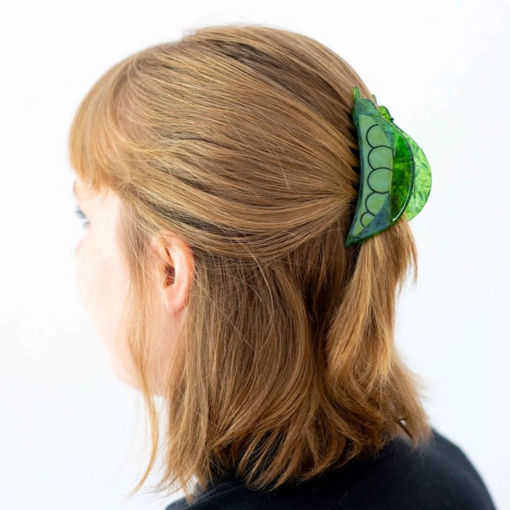 Person wearing Pea Pod Hair Claw.