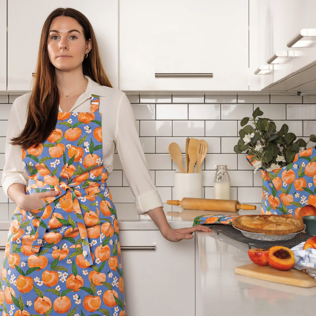 Person wearing Peaches Chef Apron.