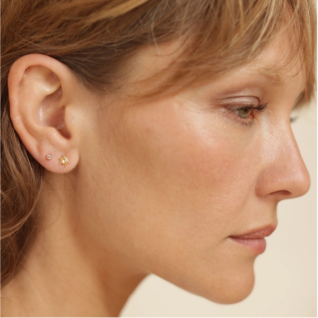 Person wearing Starburst Stud Earrings Crystal.