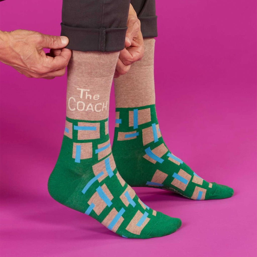 Person wearing The Coach Men's Socks.