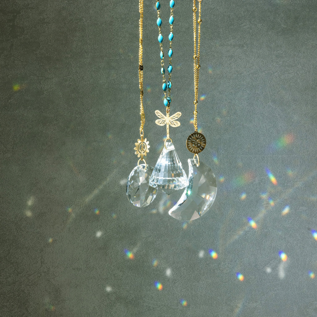 Pocket Suncatcher Peace Flower - several in window.