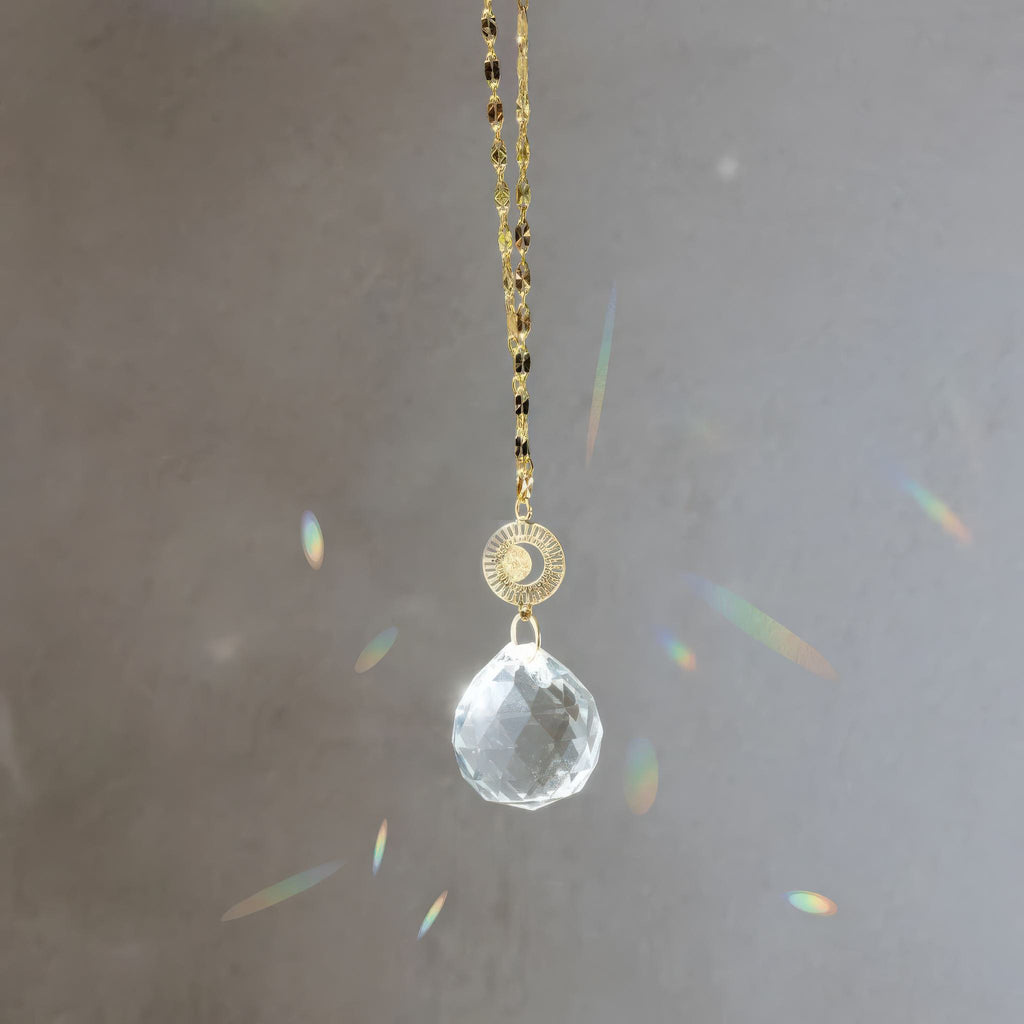 Pocket Suncatcher Radiating Moon in window.