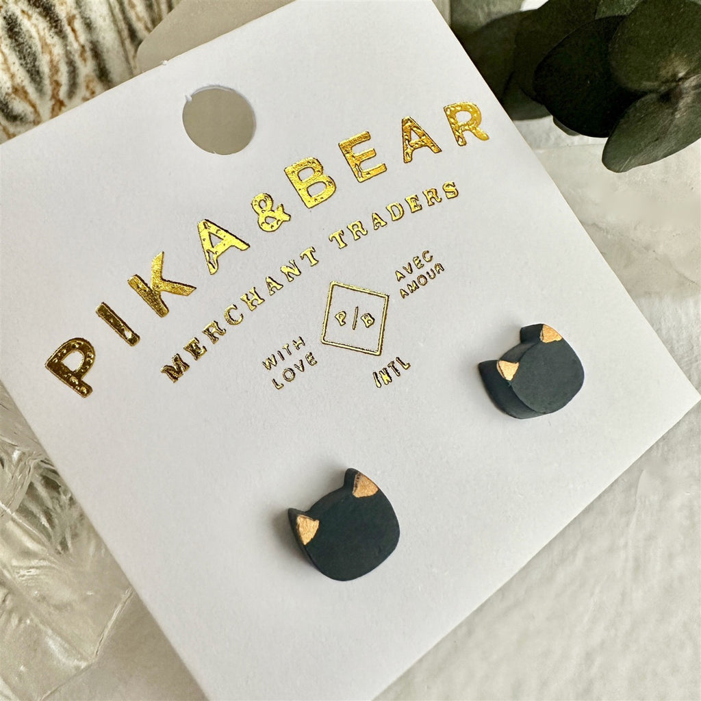 Porcelain Cat Face Stud Earrings Black packaging.