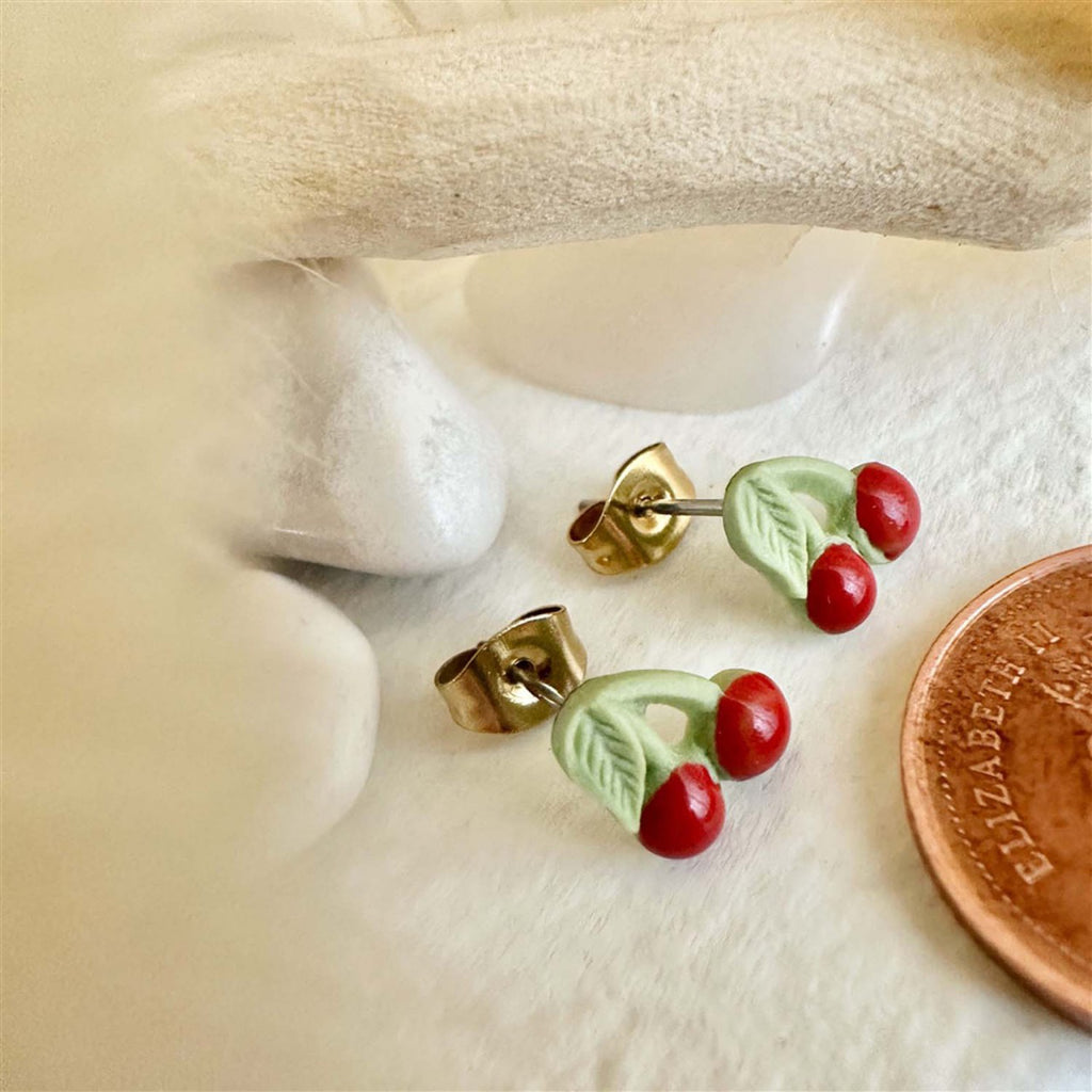 Porcelain Cherry Stud Earrings besides penny.
