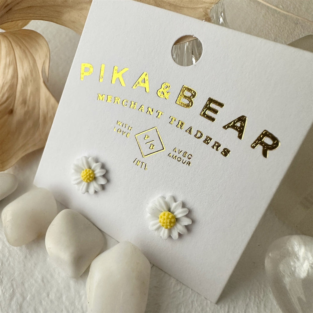 Porcelain Daisy Stud Earrings White packaging.