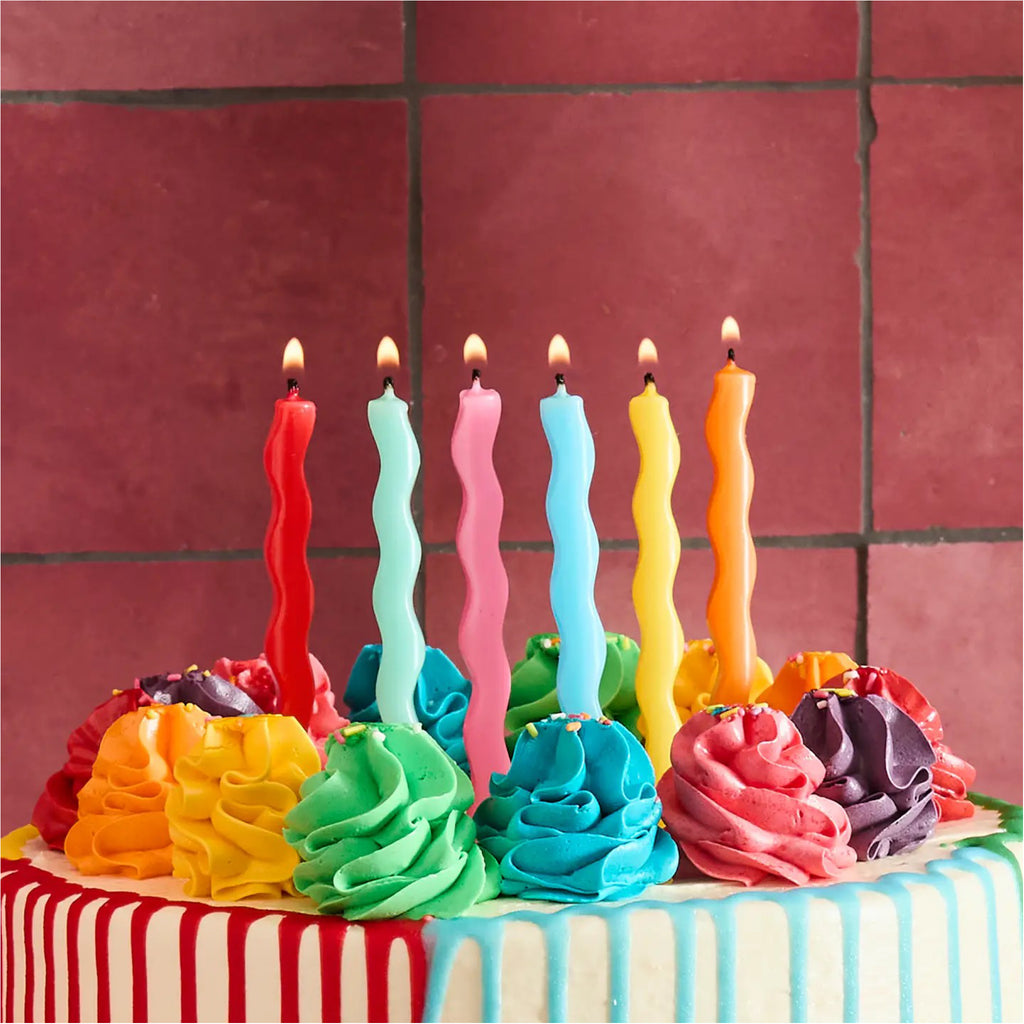 Premium Bright Wavy Birthday Candles on cake.