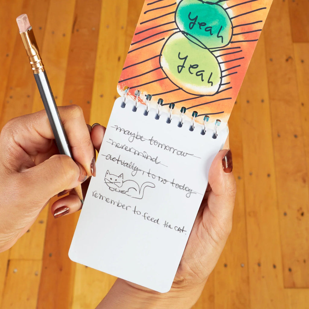 Procrastination Spiral Notebook being used.