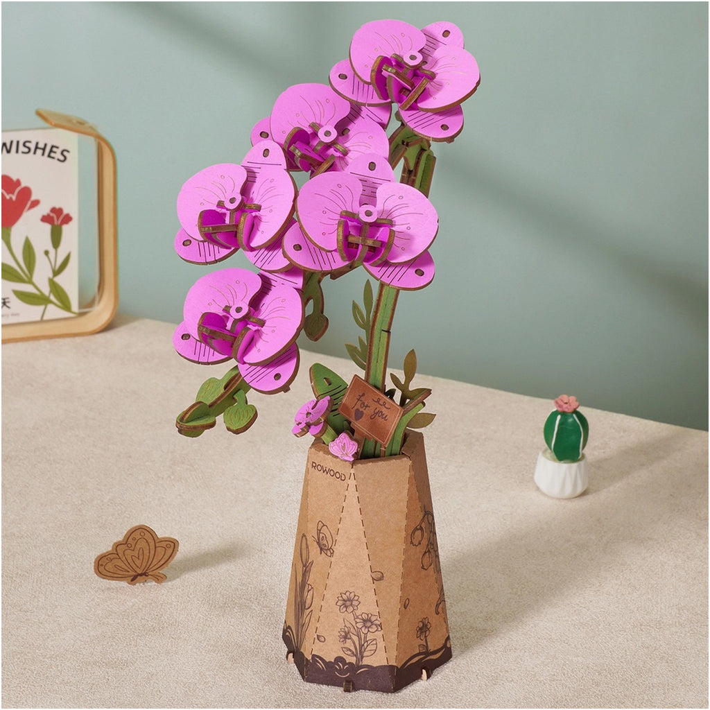 Purple Moth Orchid 3D Wooden Flower Puzzle on table.