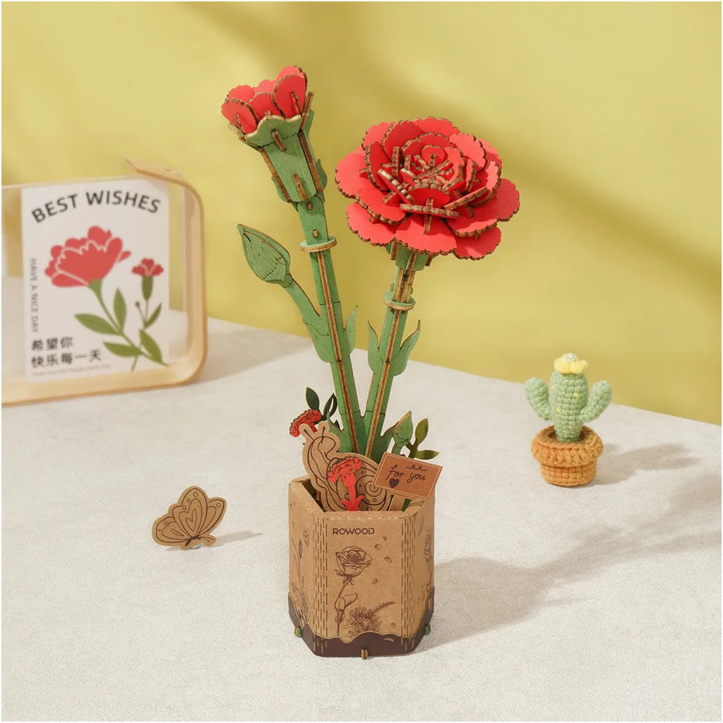 Red Carnation 3D Wooden Flower Puzzle on table.