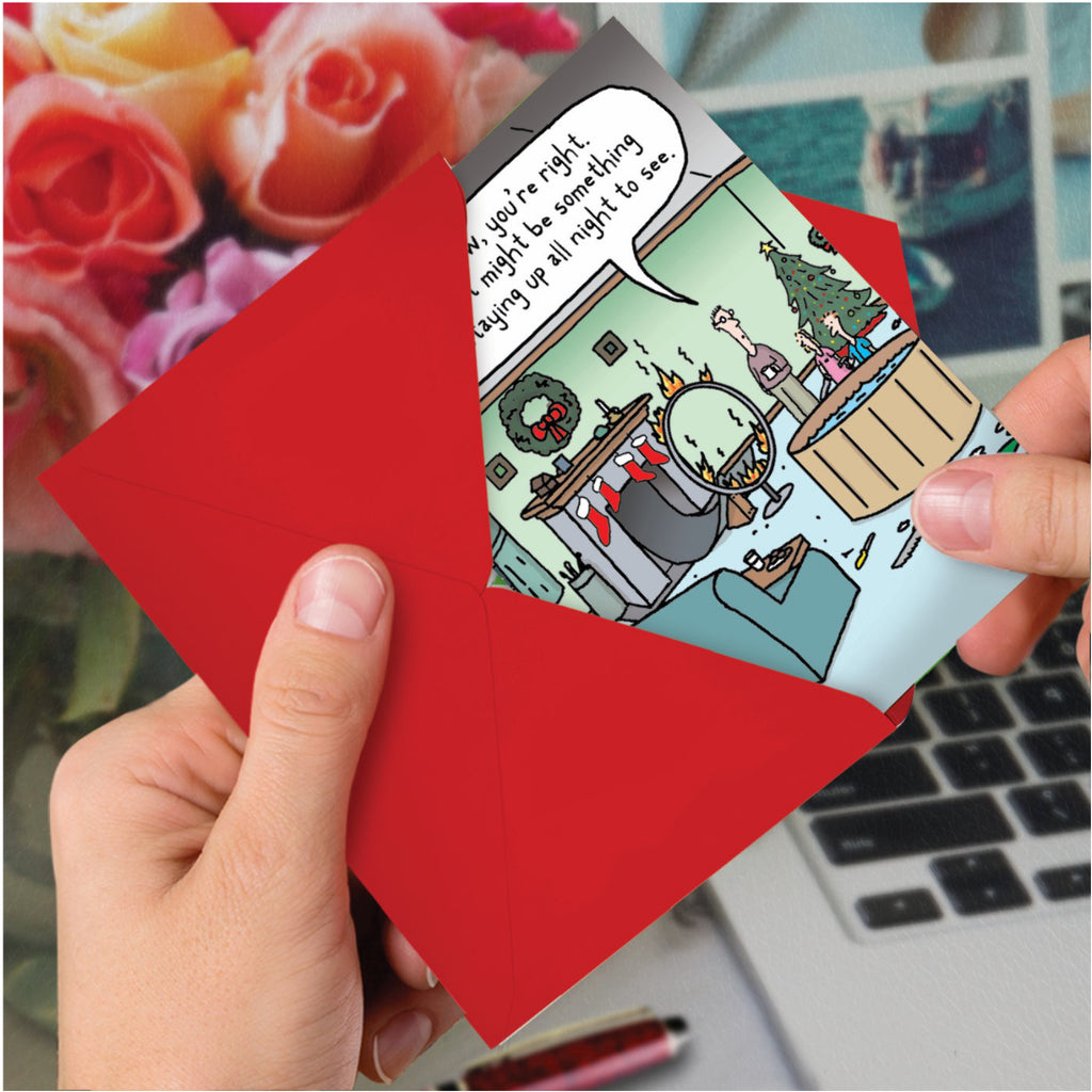 Santa Splash Christmas Card in hand.