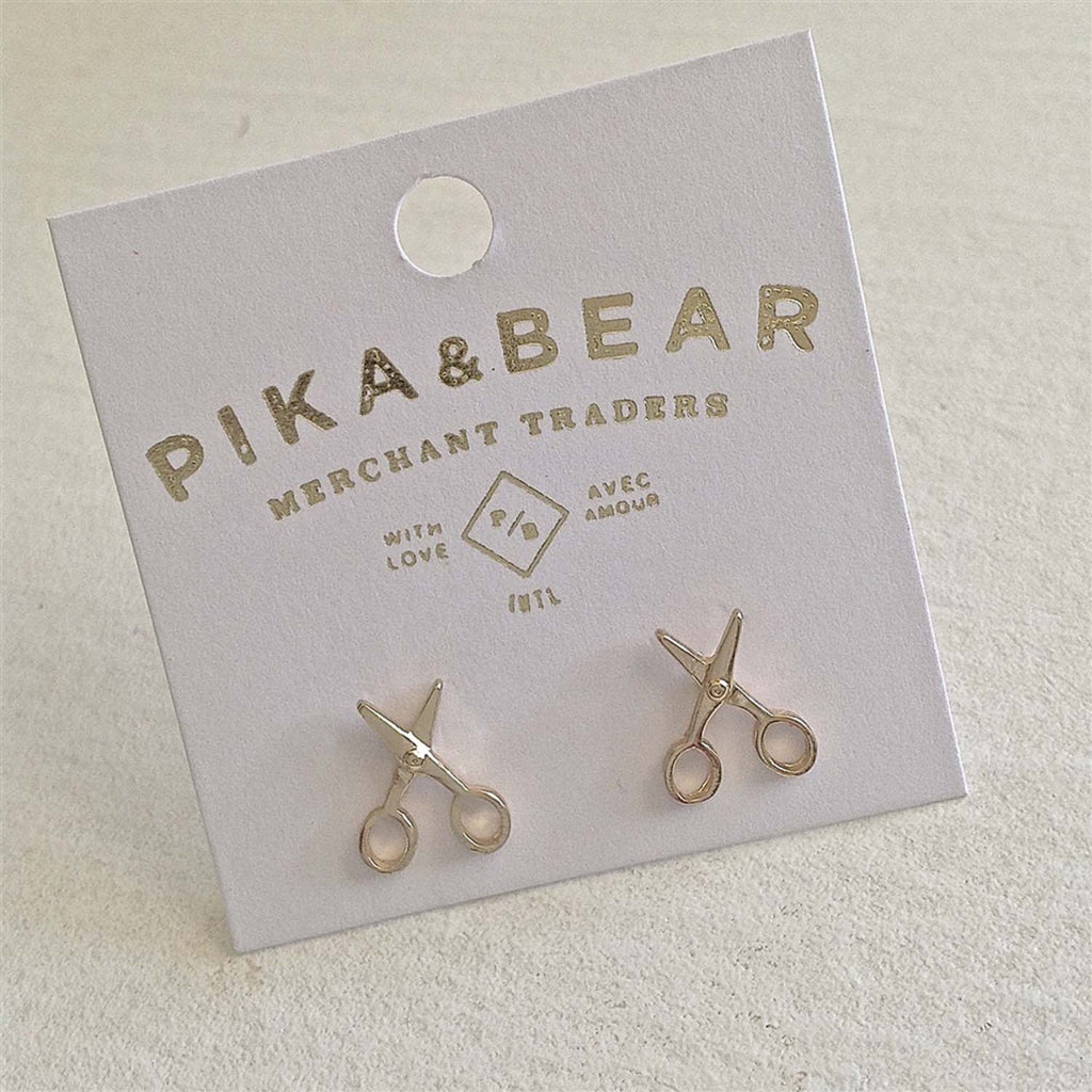 Scissor Stud Earrings Gold packaging.