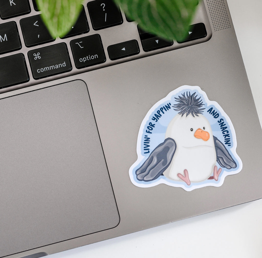 Seagull Yappin' and Snackin' Sticker on computer.