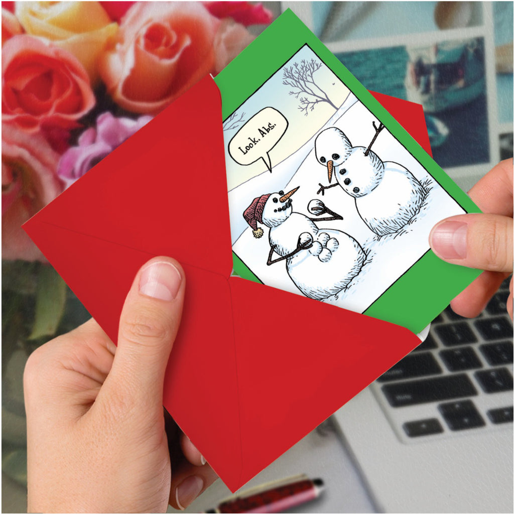 Snowman Abs Christmas Card in hand.