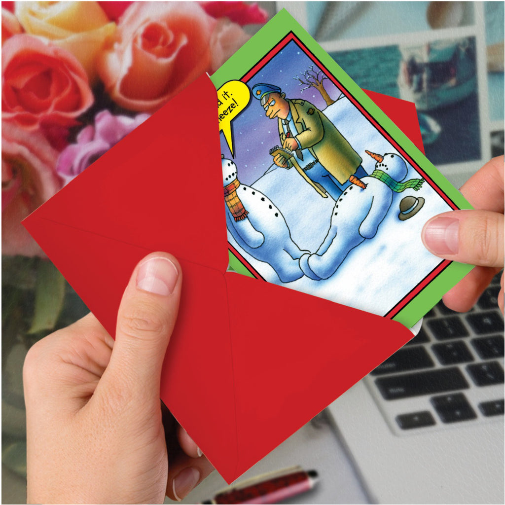 Snowman Sneeze Christmas Card in hand.