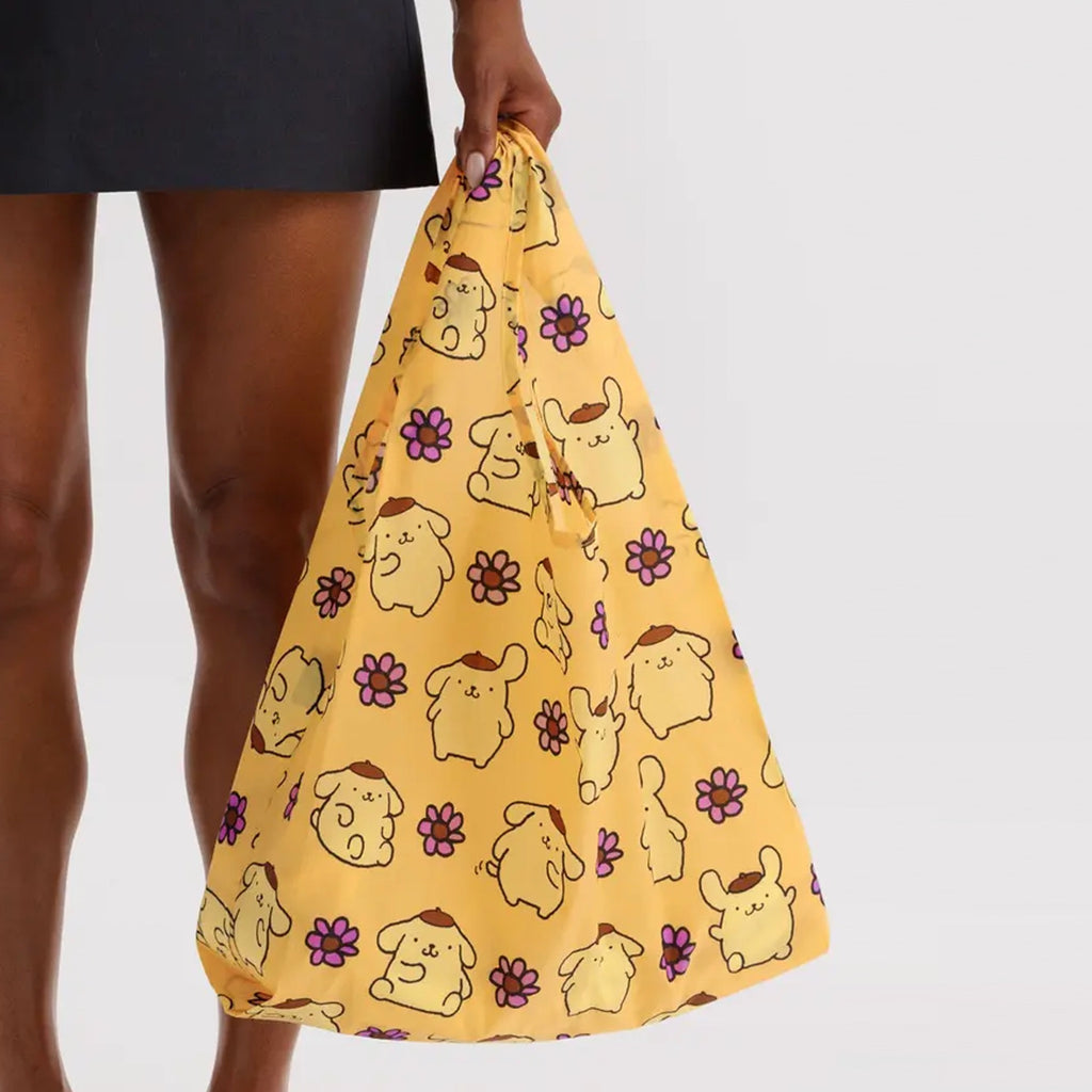 Standard Baggu Pompompurin being held.