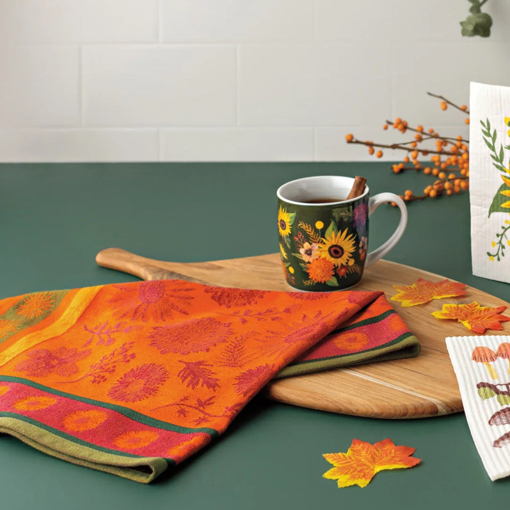 Sunflower Splendor Jacquard Dishtowel on table.