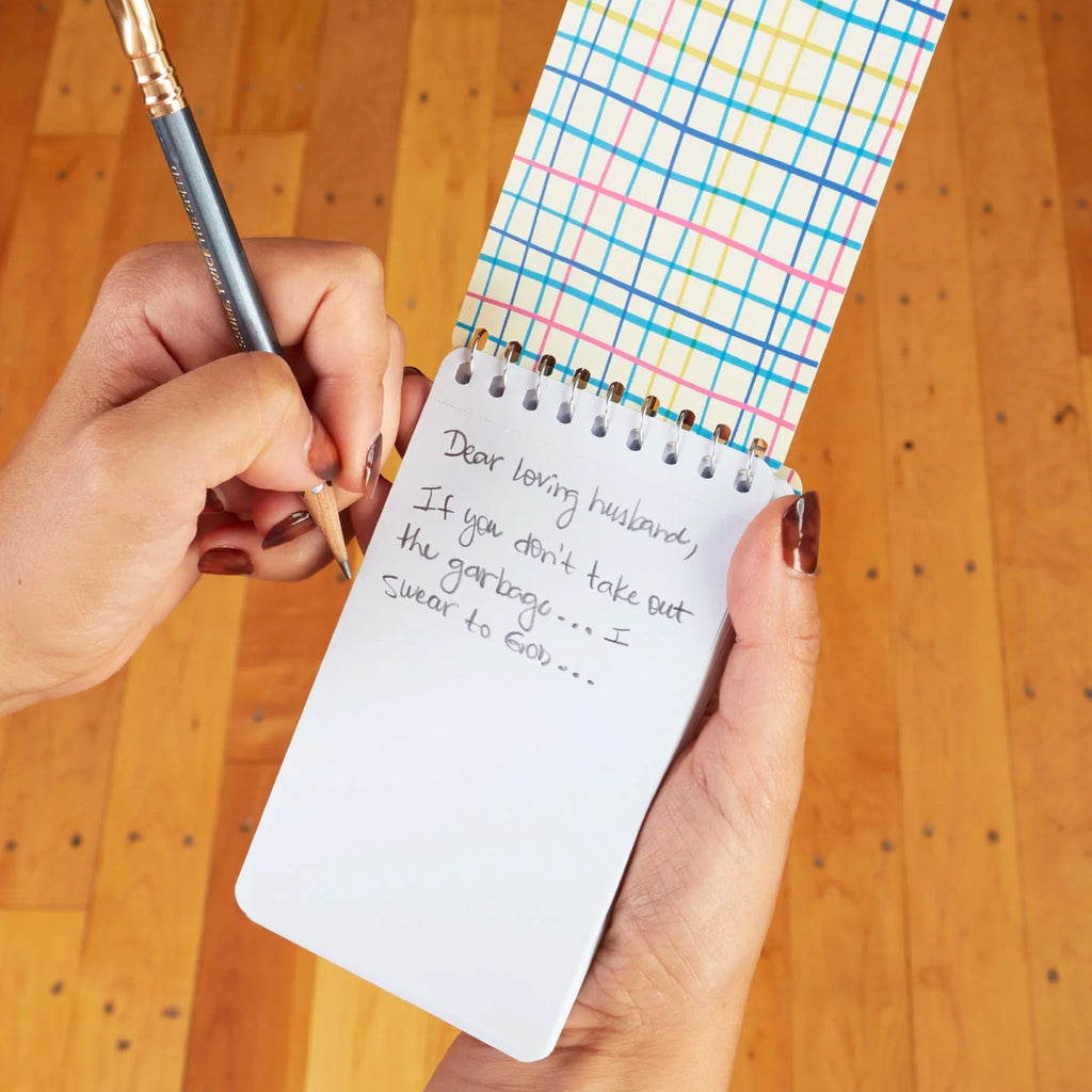Sweet Reminders Spiral Notebook being used.