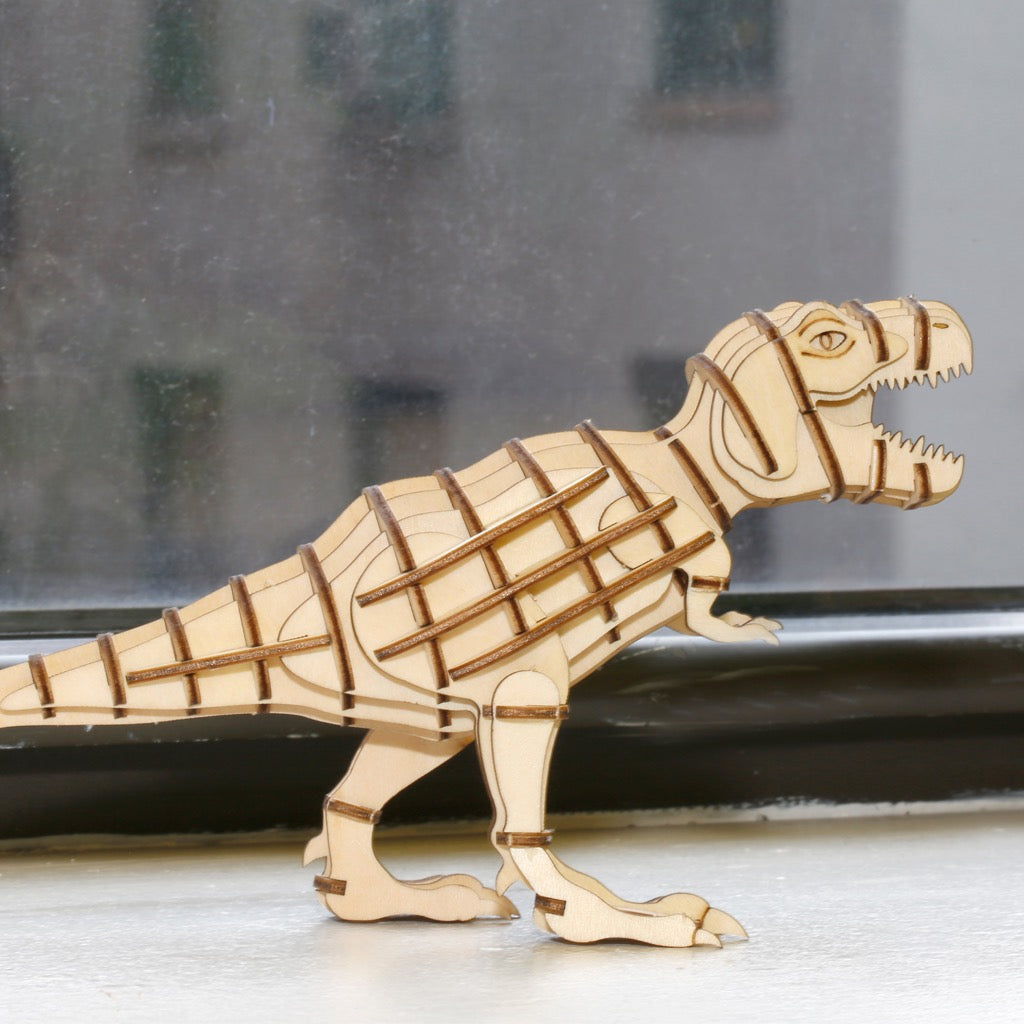 T-Rex 3D Wooden Puzzle on table.