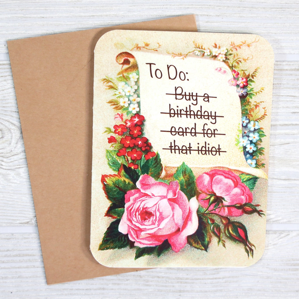 That Idiot Birthday Card on table.