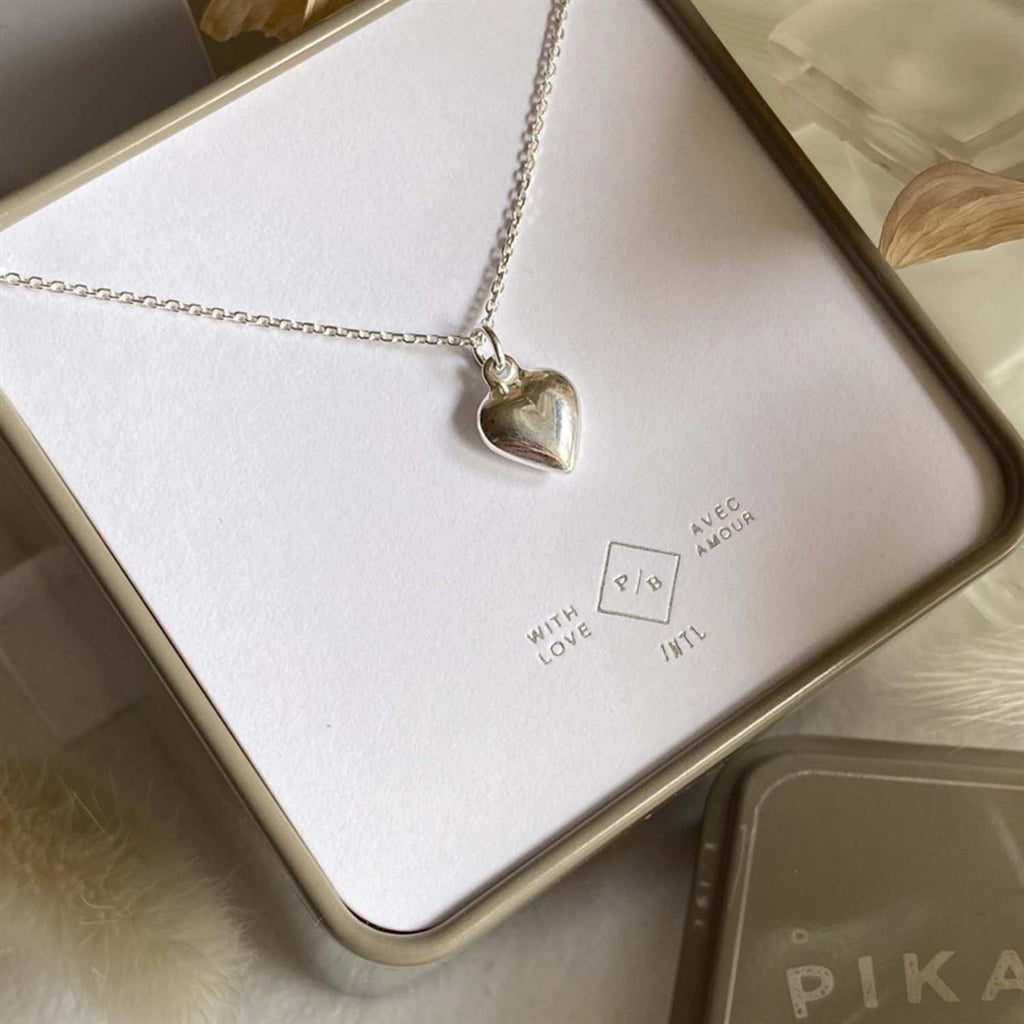 Tiny Heart Charm Necklace Silver packaging.