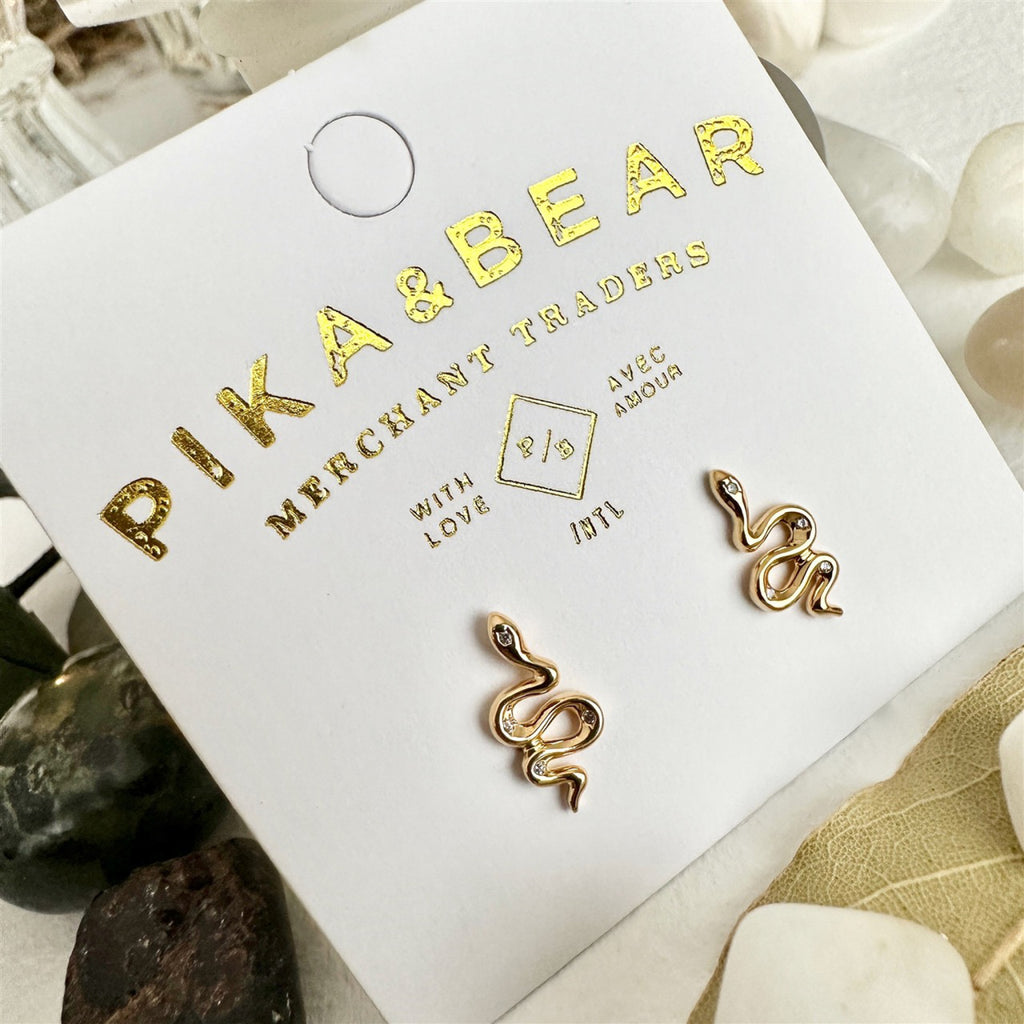 Tiny Rhinestone Snake Stud Earrings Gold packaging.