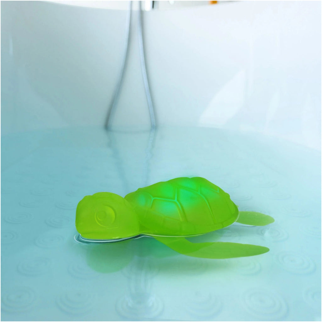 Tub Turtle Light Up Bath Toy in tub.