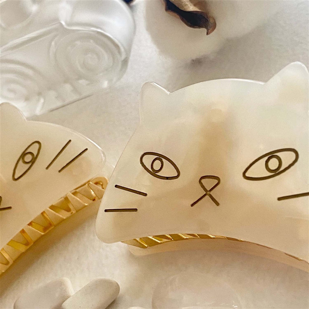 Two  ofGrumpy Cat Hair Claw Mother of Pearl.