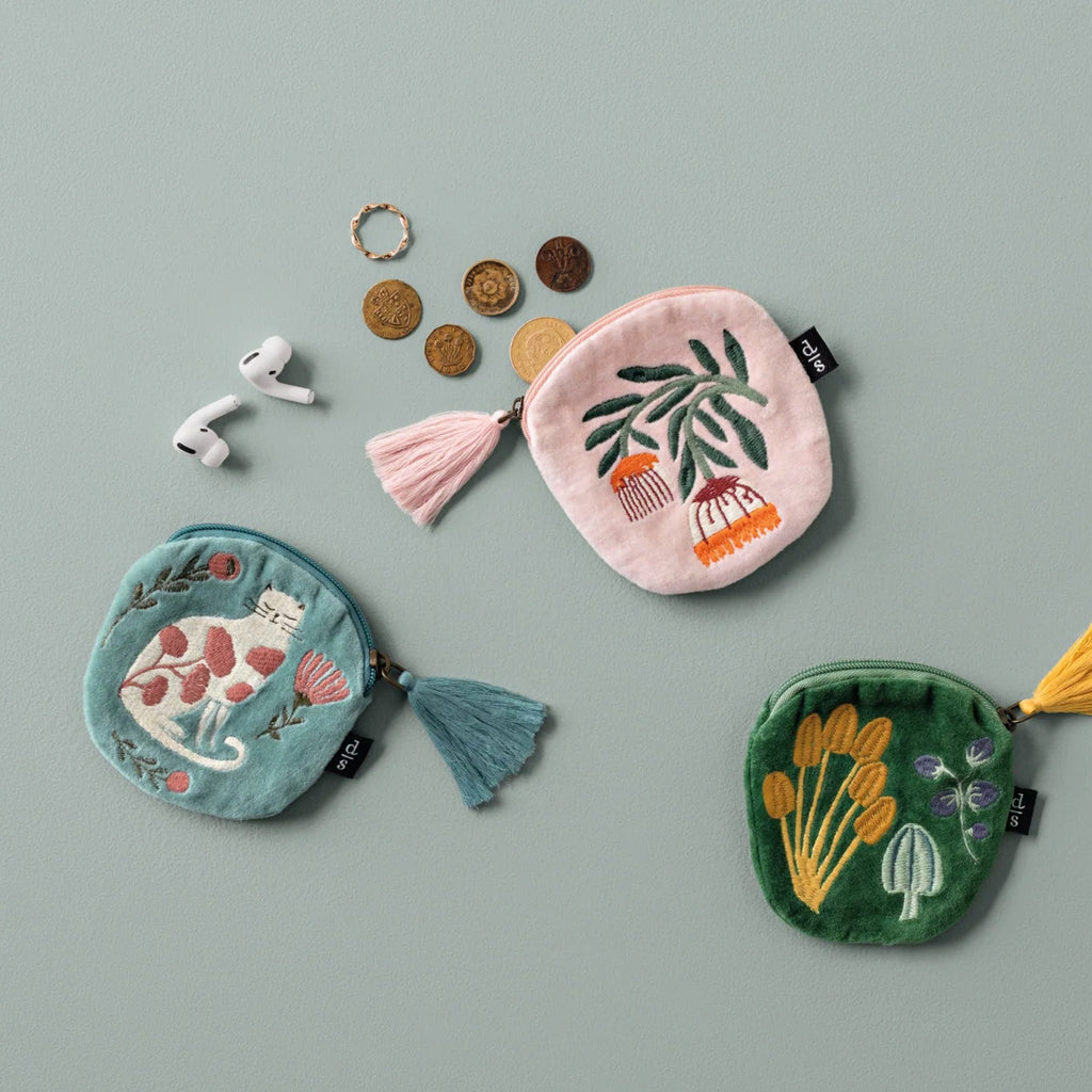 Venus Embroidered Coin Purse on table.