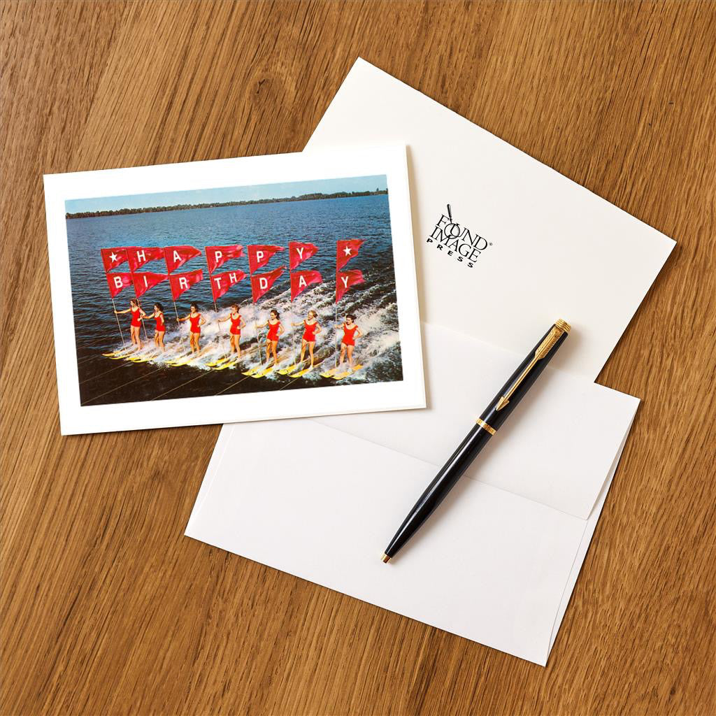 Water Skiers Happy Birthday Card on table.