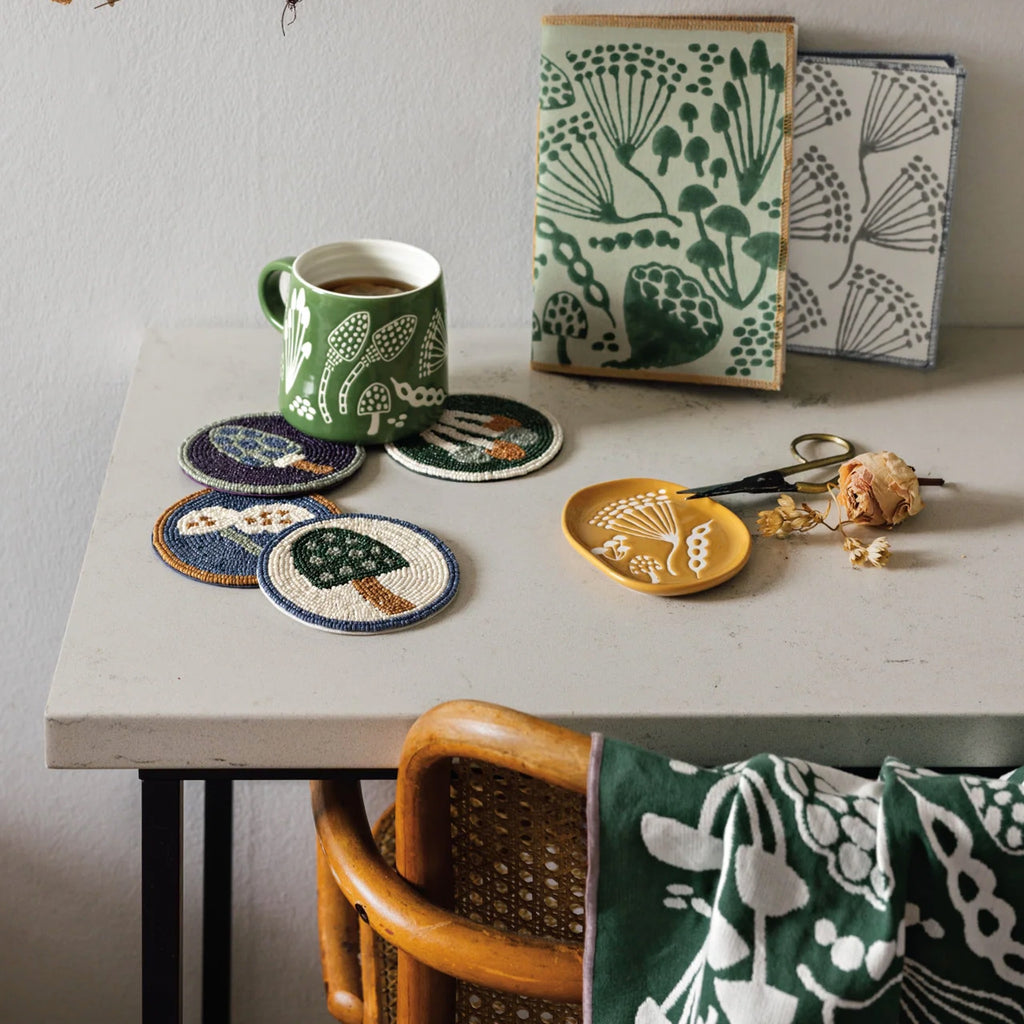 Wildgrove Beaded Coasters Set of 4 on table.