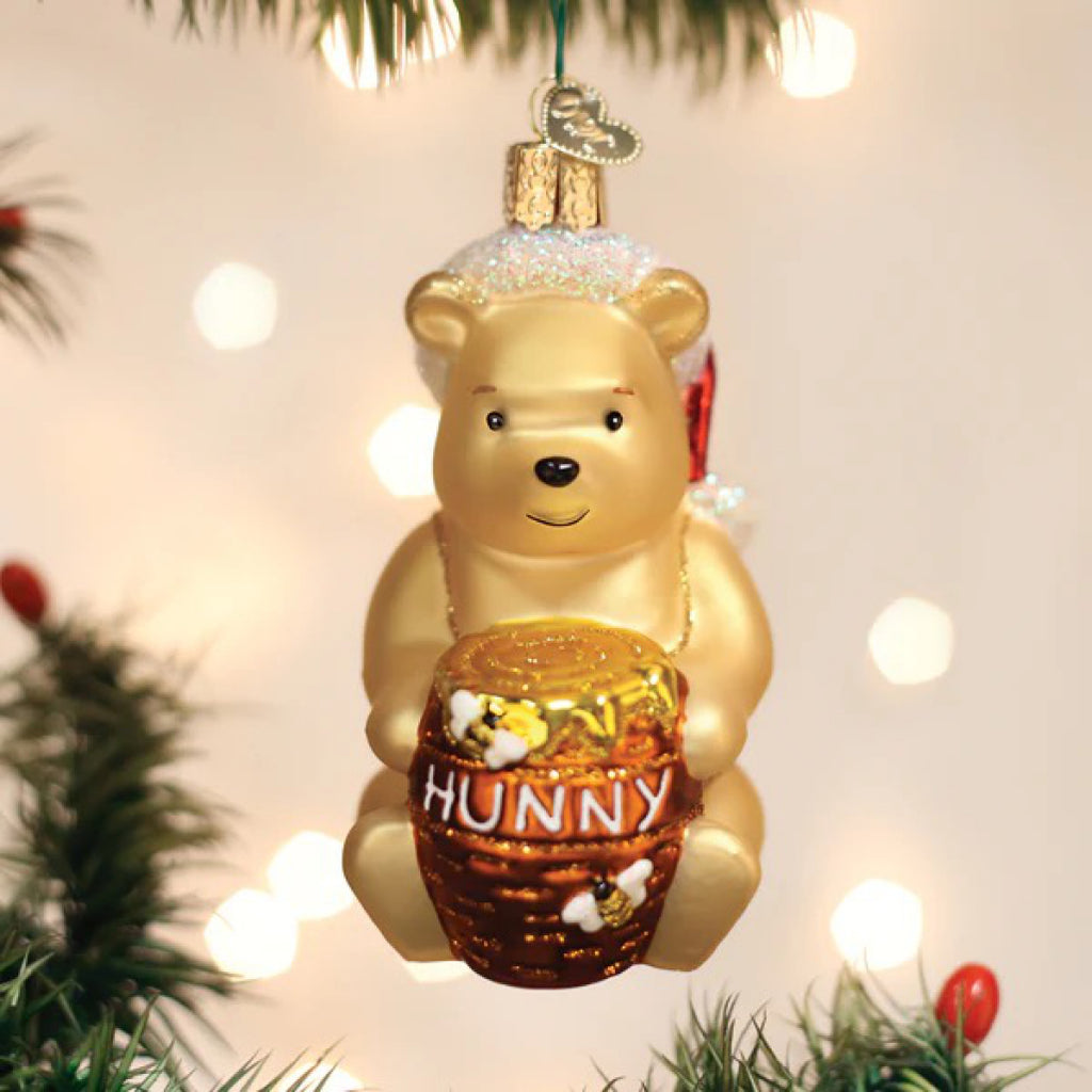 Winnie The Pooh Ornament in tree.