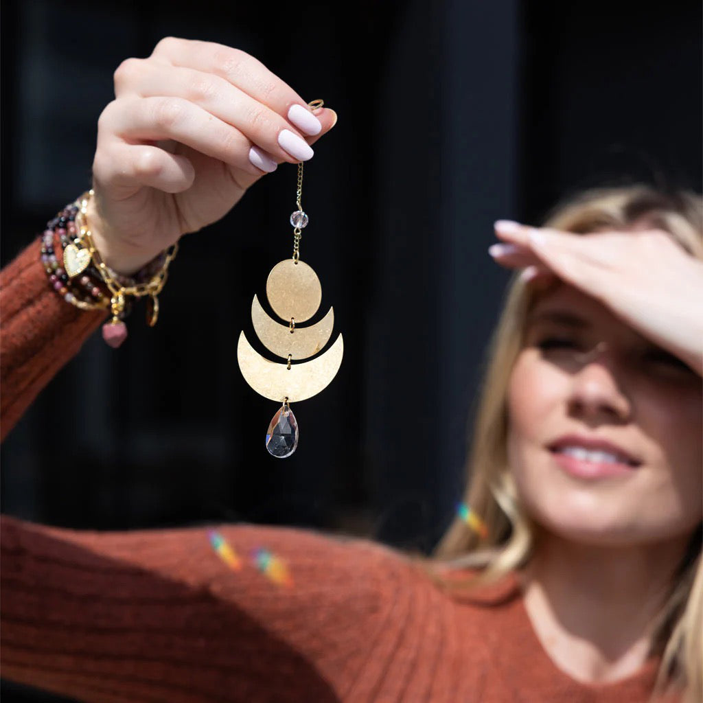 Woman holding Suncatcher Lunar/Healing.