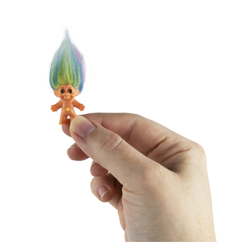 World's Smallest Good Luck Trolls in hand.