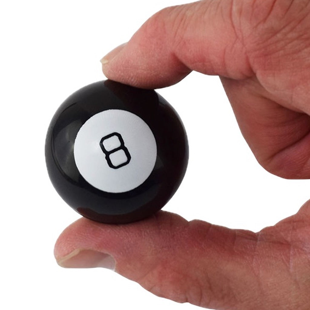 World's Smallest Magic 8 Ball being held.