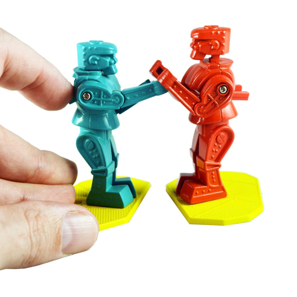 World's Smallest Rock 'Em Sock 'Em Robots in hand.