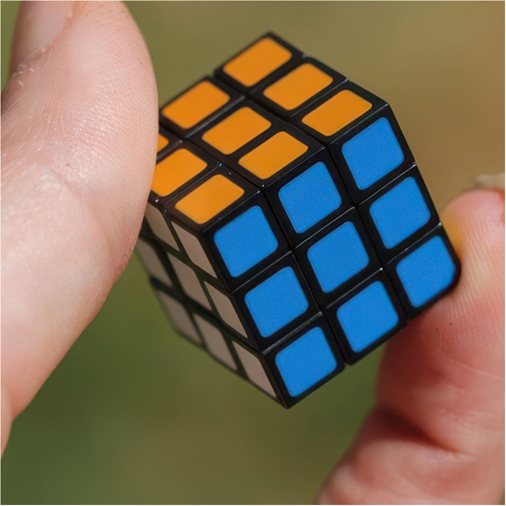 World's Smallest Rubik's Cube in hand.