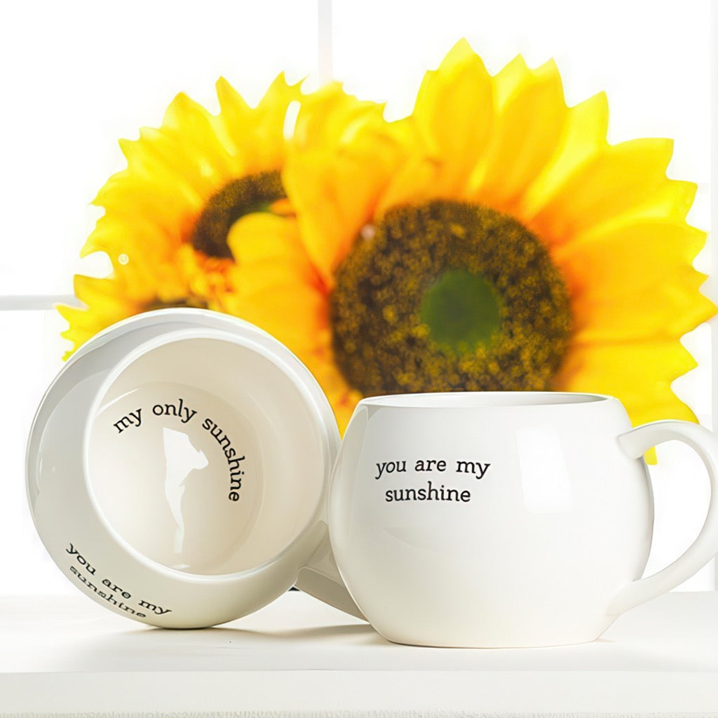 You Are My Sunshine Ball Mug on table.