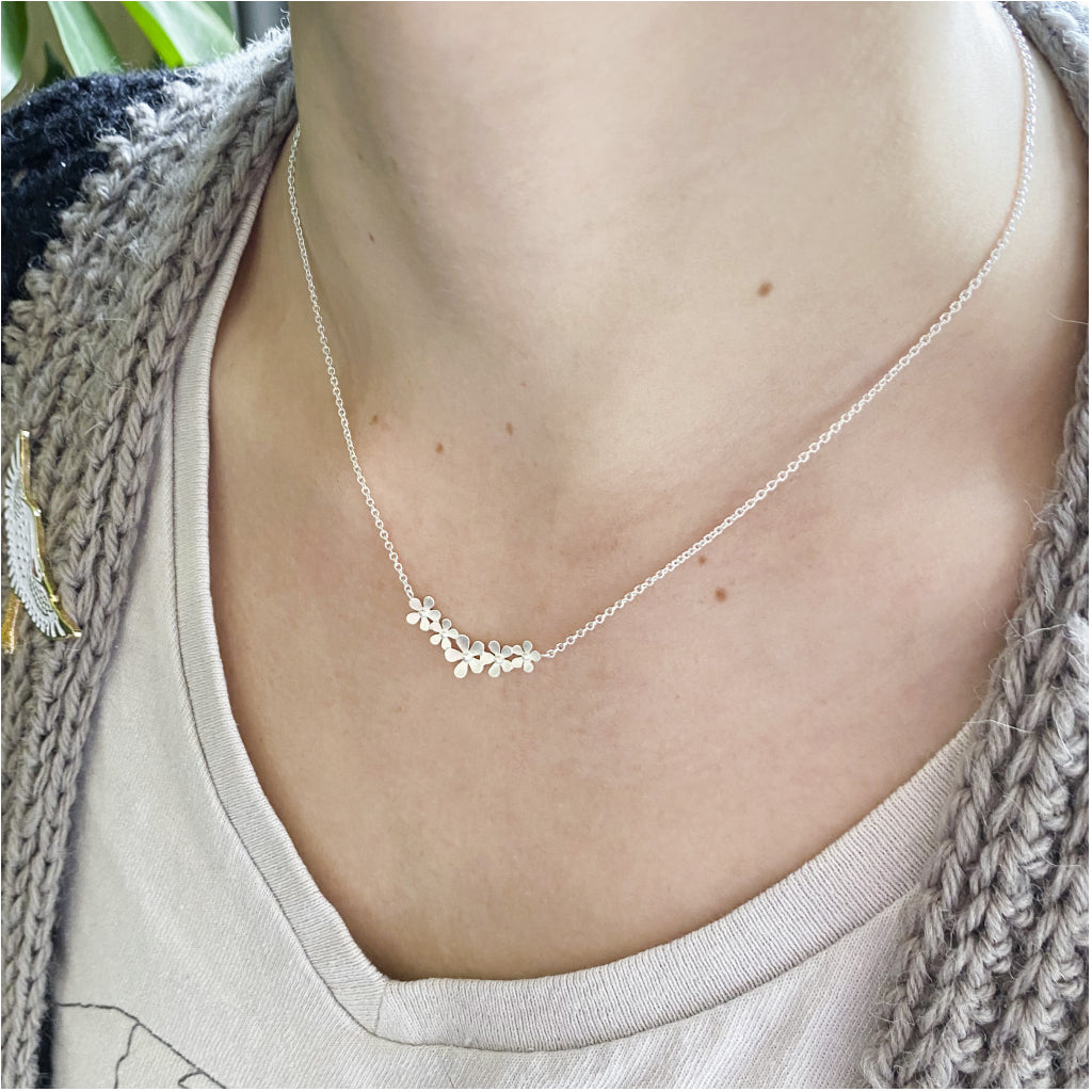 Curve of Flowers Necklace Brushed Sterling Silver Lifestyle