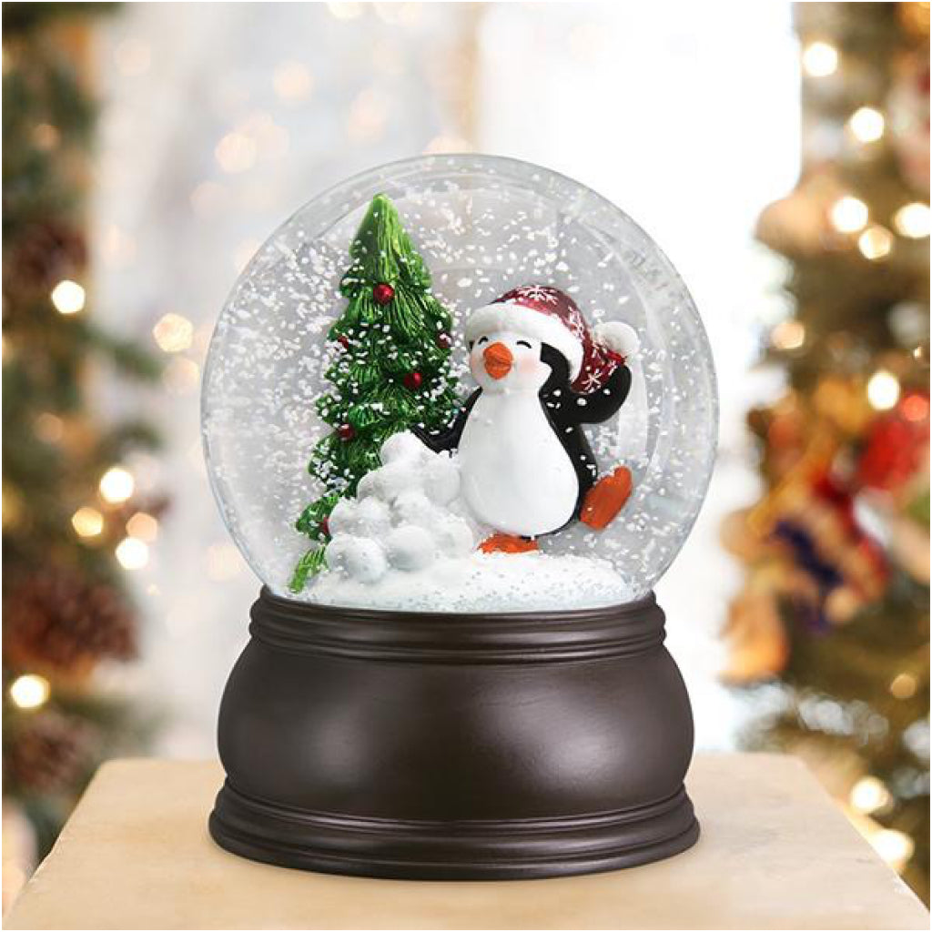 Lifestyle shot of Dancing Penguin Snow Globe.