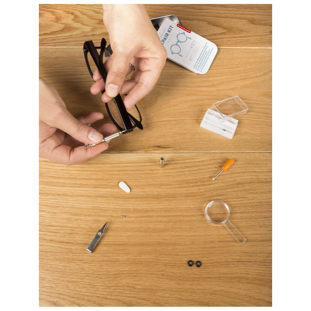 Fixing glasses with Eyeglass Repair Kit.