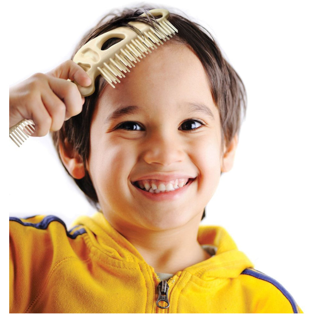 Child using Bonehead Folding Comb.
