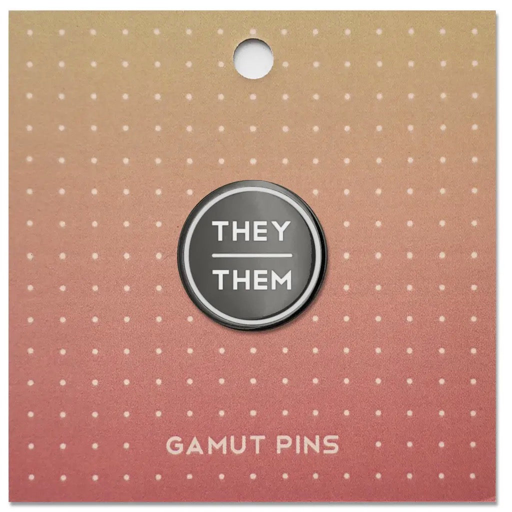 Anthracite Enamel Pronoun Pin: They/Them packaging.
