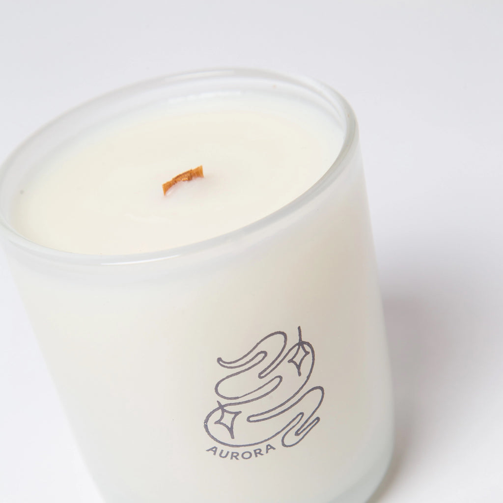 Aurora Coconut Soy Candle on surface.