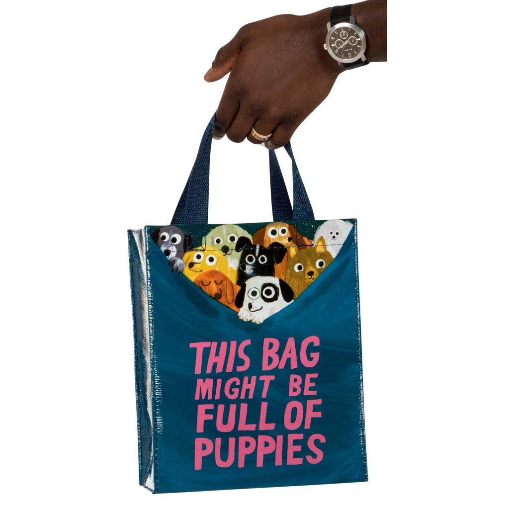 Bag Full of Puppies Handy Tote person holding.