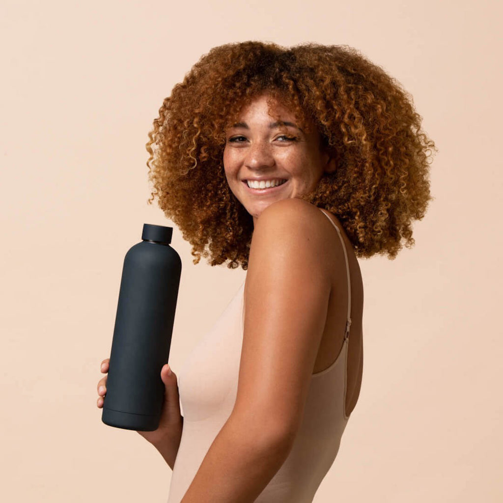 Beysis Water Bottle being held.